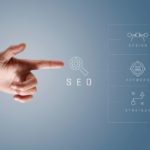 Finger pointing at key components of SEO